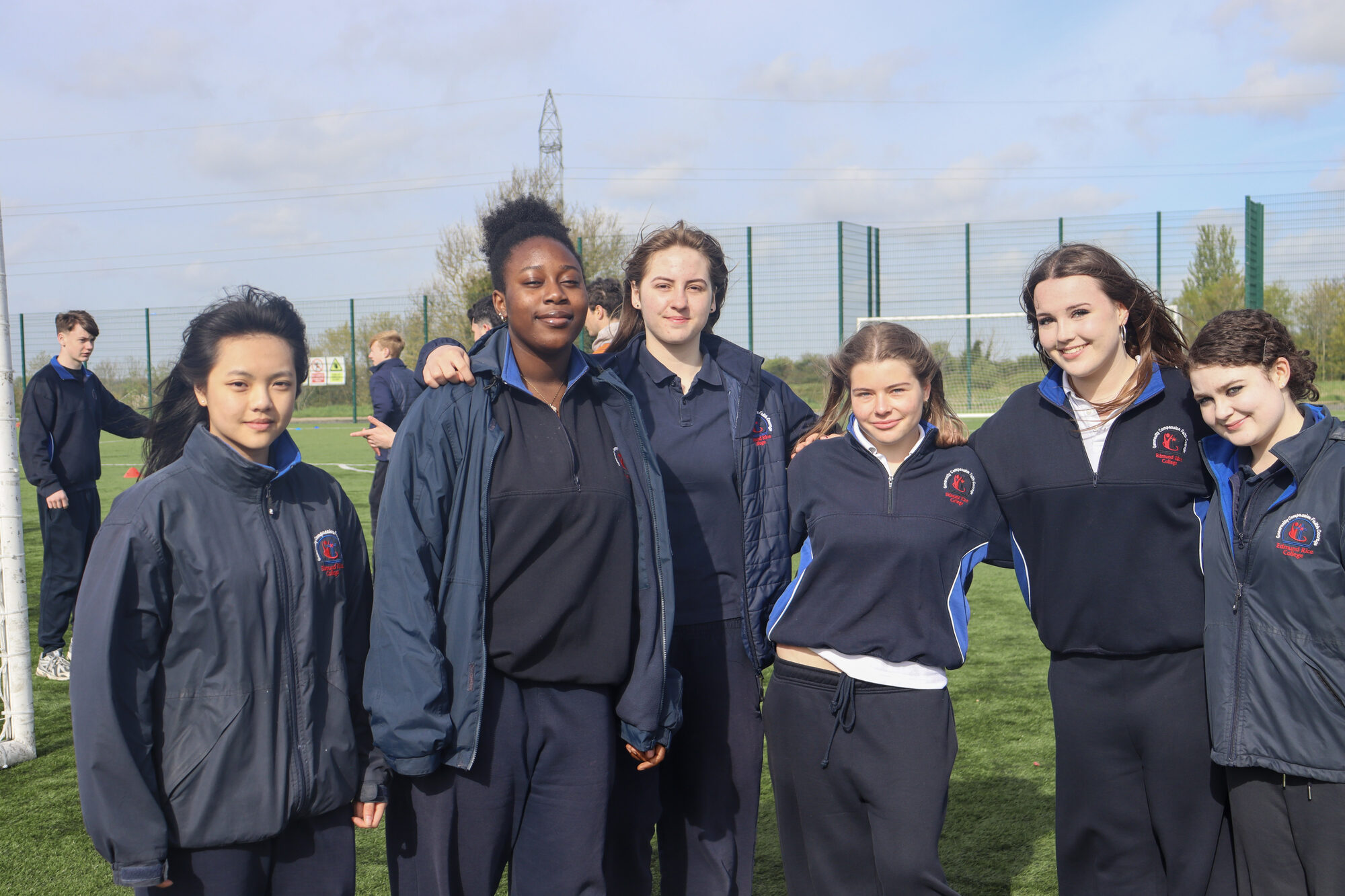 Transition Year students smiling together on a sports pitch at a S'port for Grief festival